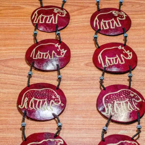 Traditional African calabash wall hanging made from natural gourd with cultural designs
