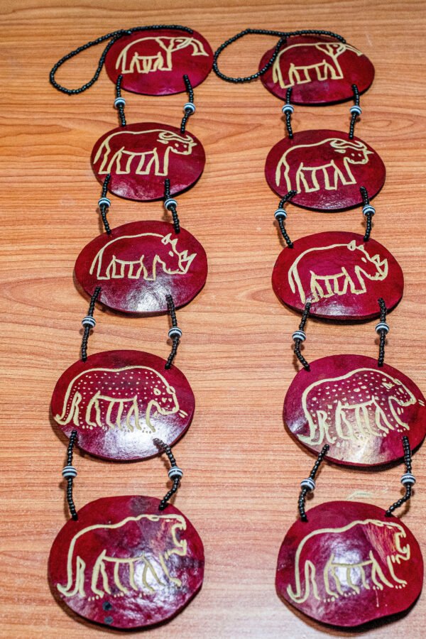 Traditional African calabash wall hanging made from natural gourd with cultural designs