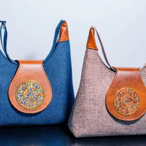 Set of two handmade leather bags, including a large handbag and a smaller crossbody bag