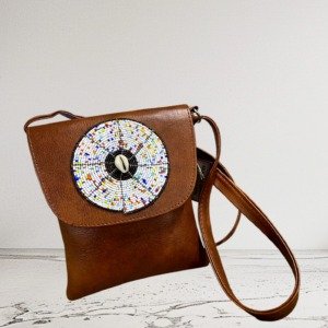 Handcrafted leather sling mobile bag with African-inspired design from Selections Souvenirs