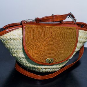 Handwoven sisal bag decorated with colorful African beadwork, made by Kenyan artisans