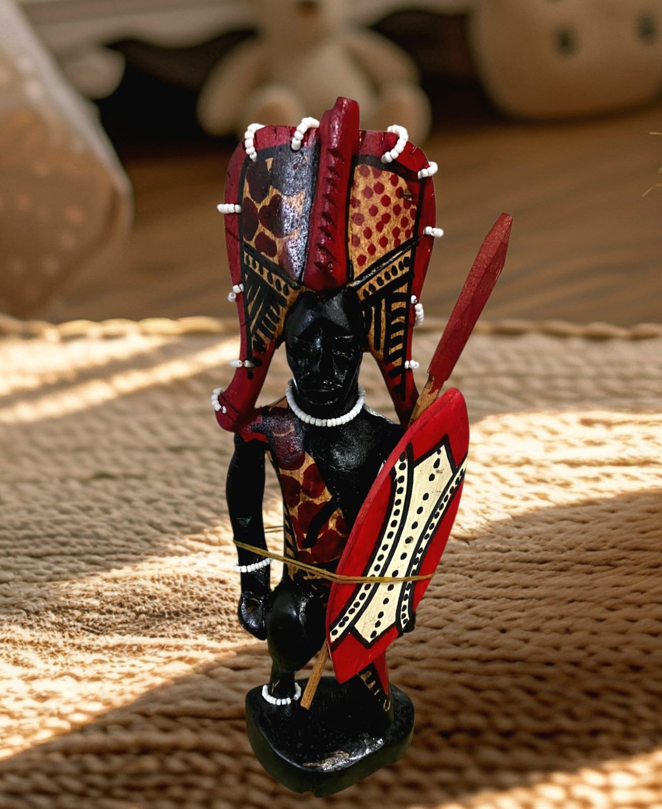 The Kneeling Maasai sculpture Detailed kneeling Maasai figurine handcrafted in African tribal style, available at Selections Souvenirs